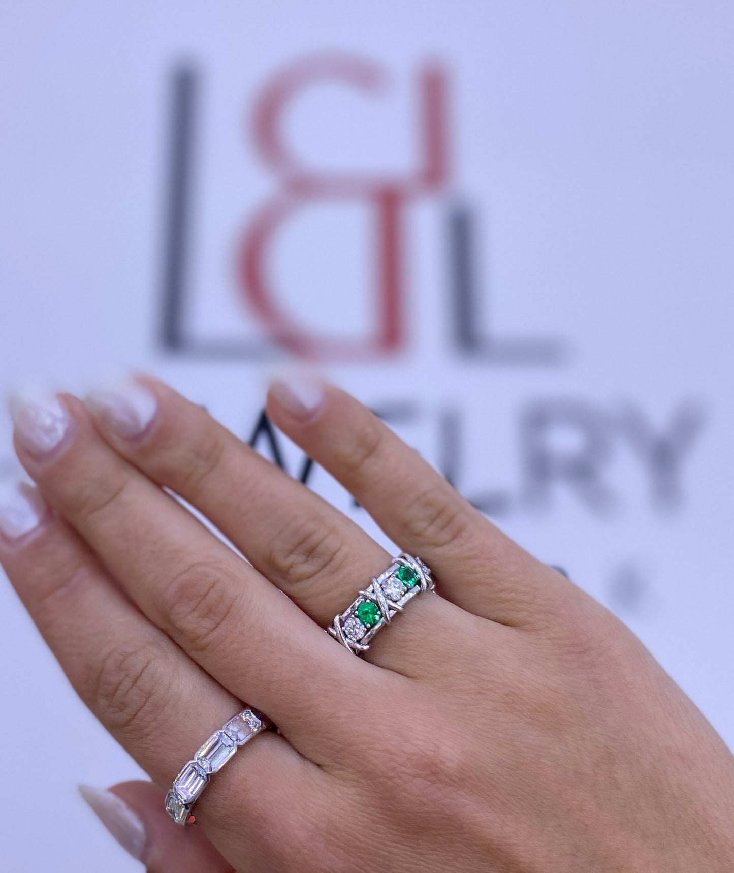 Round-Cut Emerald and Diamond Eternity X-Style Ring in Platinum