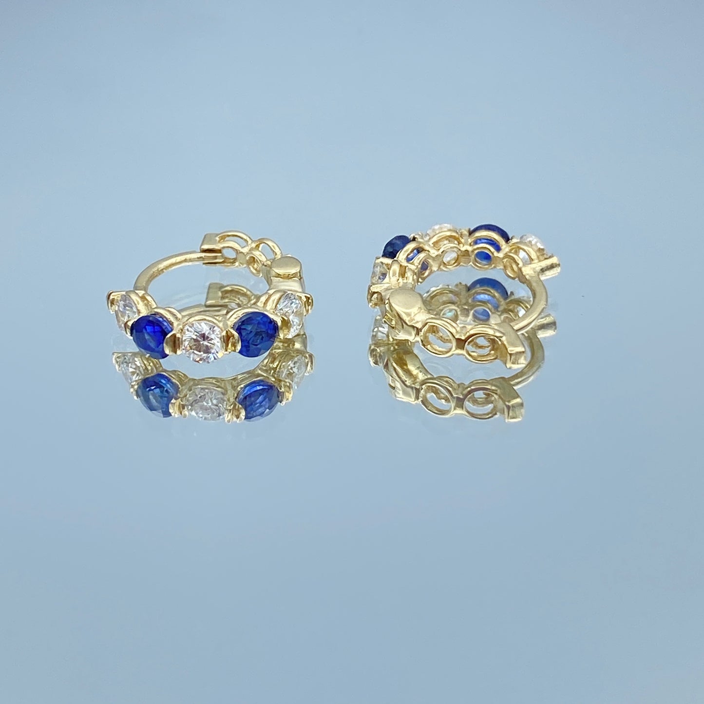 Blue Sapphire and Diamond Huggie Earrings in 14K Yellow Gold