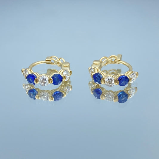 Blue Sapphire and Diamond Huggie Earrings in 14K Yellow Gold