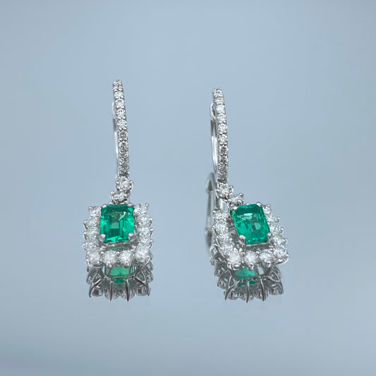 Emerald and Diamond Halo Dangle Earrings in 18K White Gold