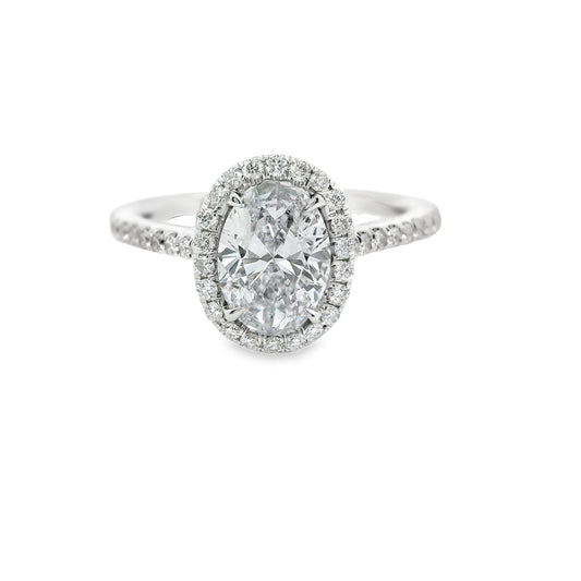 Oval-Cut Diamond Halo Engagement Ring in 14K Yellow Gold.