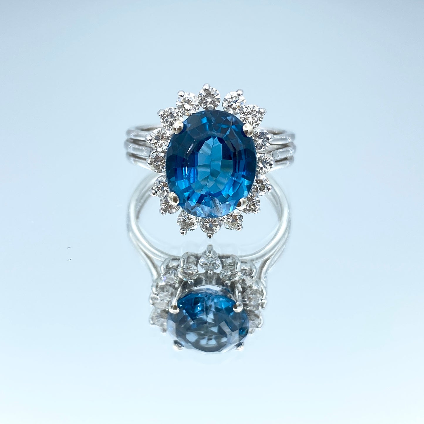Blue Topaz Ring with a Diamond Halo in 14K White Gold - L and L Jewelry