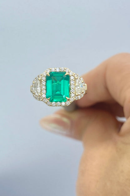 Emerald and Diamond Halo Ring in 14K Yellow Gold