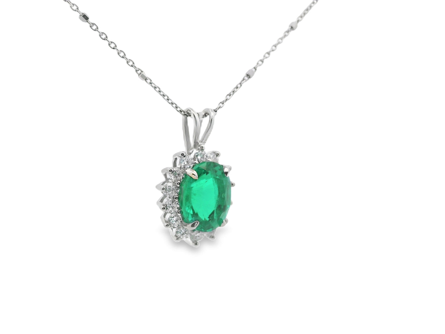 Floral Halo Design Emerald and Diamond Necklace in 14K White Gold