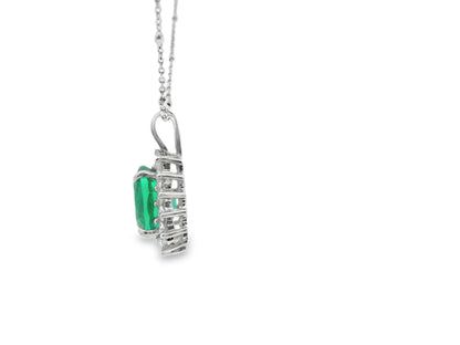 Floral Halo Design Emerald and Diamond Necklace in 14K White Gold