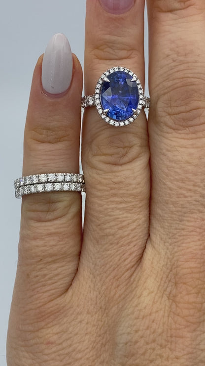Oval-Cut Tanzanite Ring with Diamond Halo in 14K White Gold