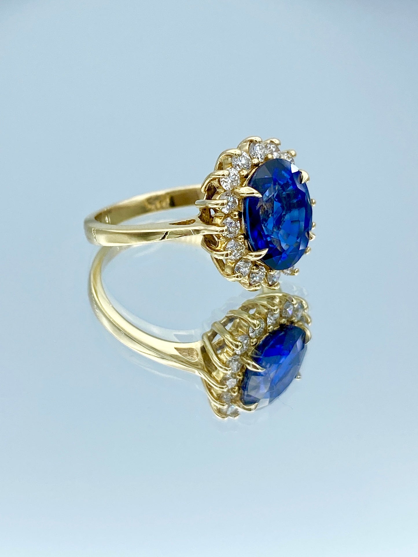 Oval-Cut Blue Sapphire Ring with Diamond Halo in 14K Yellow Gold - L and L Jewelry