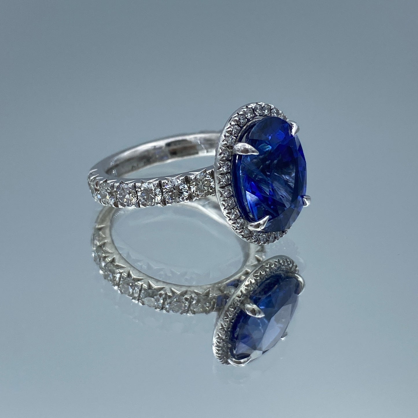 Oval-Cut Blue Sapphire with Diamond Halo in Platinum - L and L Jewelry