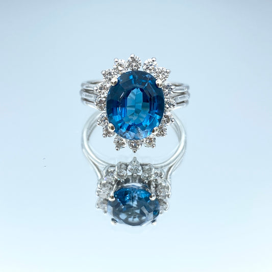 Blue Topaz Ring with a Diamond Halo in 14K White Gold - L and L Jewelry